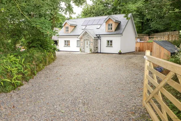 The Grove new-build cottage exterior with gravel drive