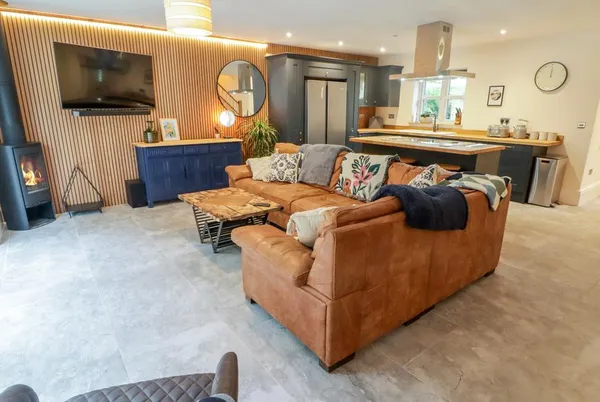 The Grove design-led lounge and kitchen with timber-slat feature wall