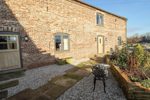 The Hay Barn brick barn conversion with arched windows