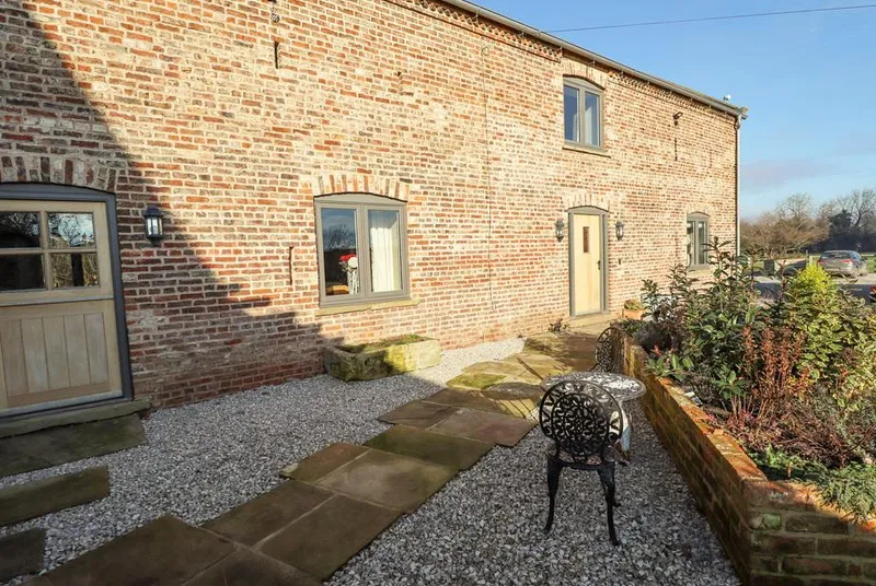 The Hay Barn brick barn conversion with arched windows