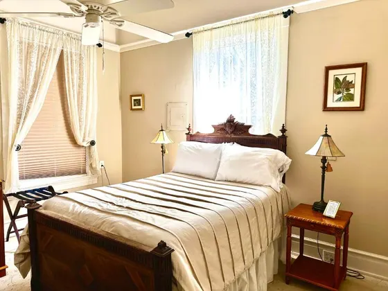Bedroom with a large bed and a window