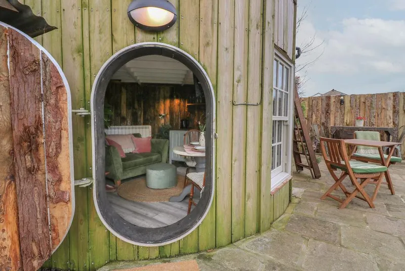 The Lazy Squire unique oval doorway with rustic cladding