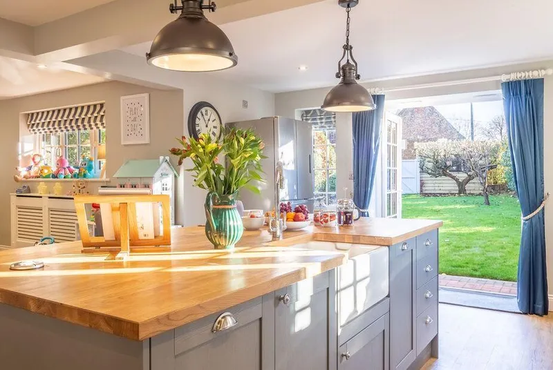 The Malthouse Dersingham kitchen with French doors open to garden