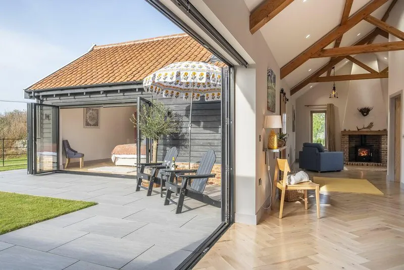The Milking Parlour patio doors opening to west-facing courtyard