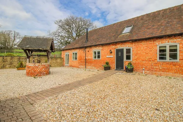 The Milking Parlour long brick barn facade