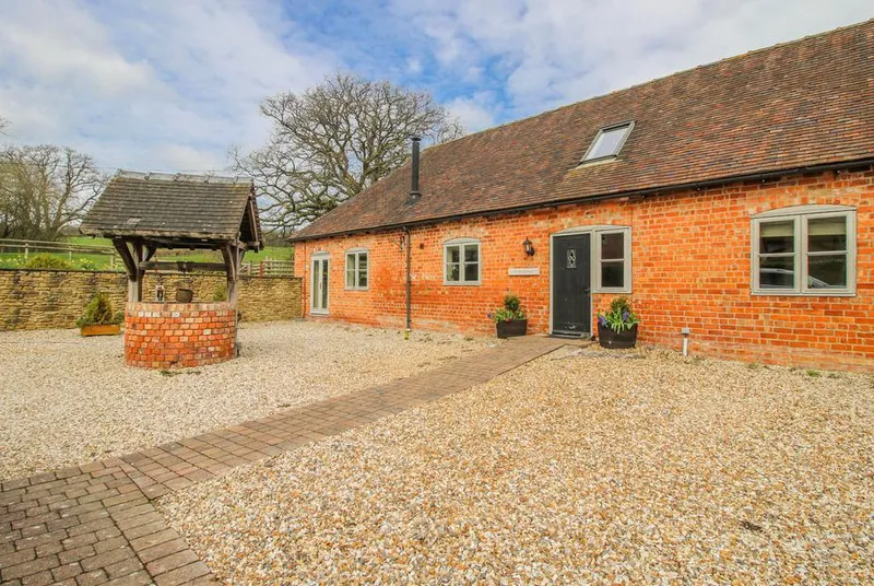 The Milking Parlour long brick barn facade