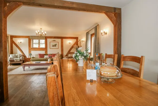 The Milking Parlour dining table leading into the lounge