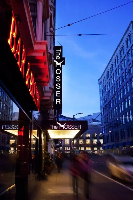 Neon sign for the moseer on a city street