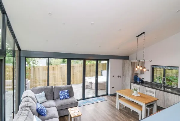 The Nest Brython open-plan living with vaulted ceiling and floor-to-ceiling glass