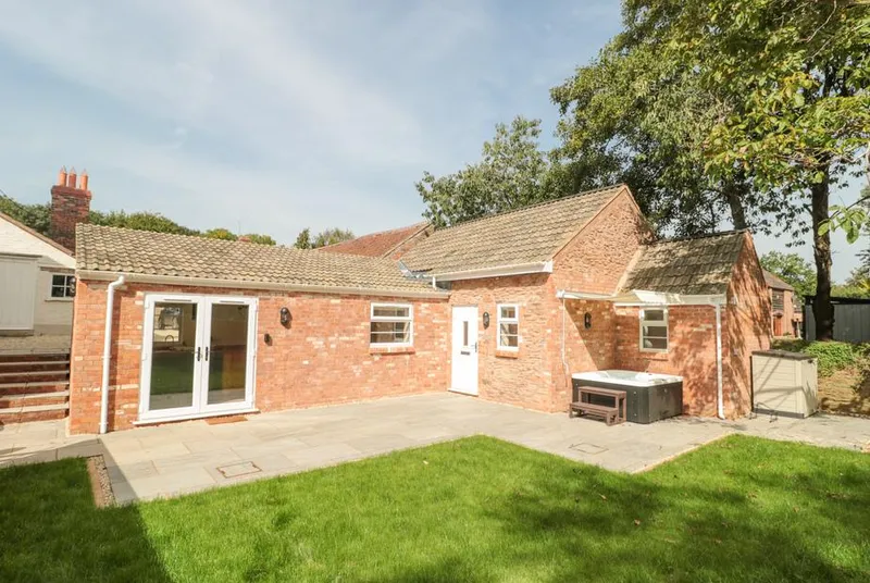 The Nest single-storey bungalow with green lawn