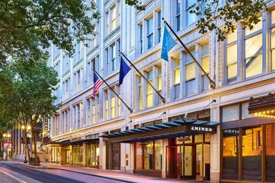 Building with flags on the side of a street