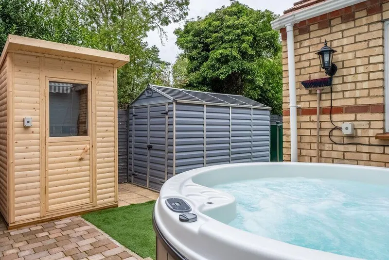 The Old Chapel Pentney hot tub and sauna cabin in private courtyard