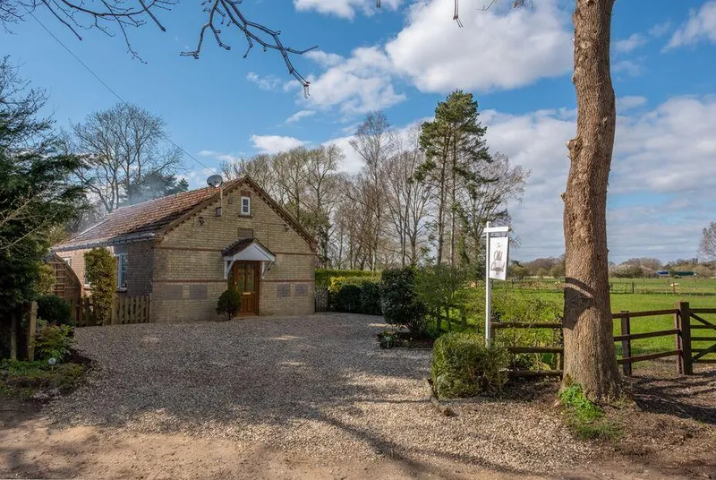 The Old Chapel Pentney stone chapel building in countryside setting