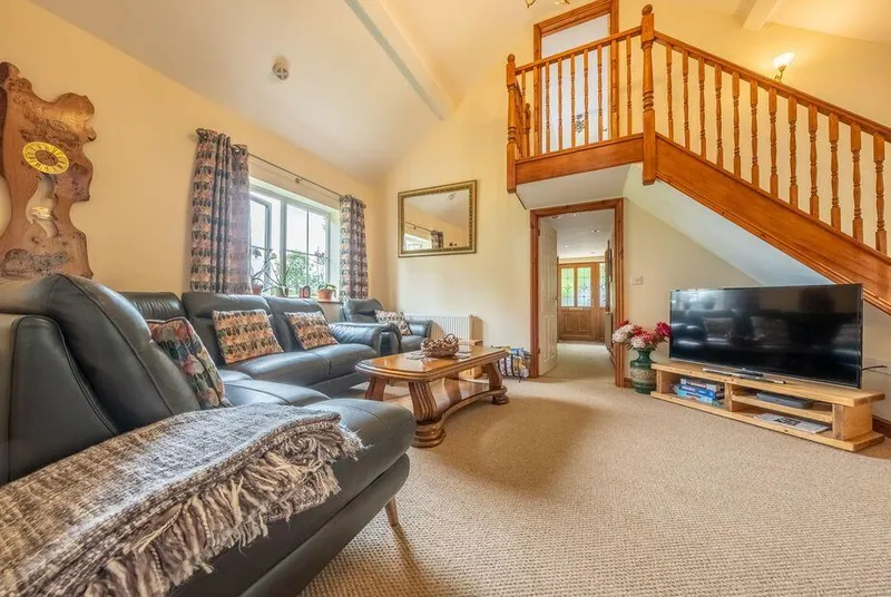 The Old Chapel Pentney vaulted living room with mezzanine gallery