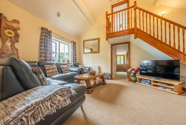 The Old Chapel Pentney vaulted living room with mezzanine gallery
