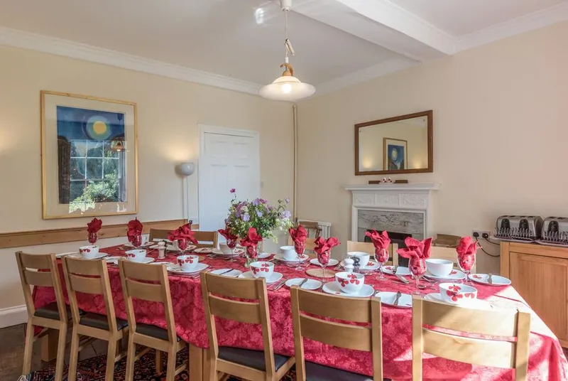 The Old Schoolhouse long dining table set for a group