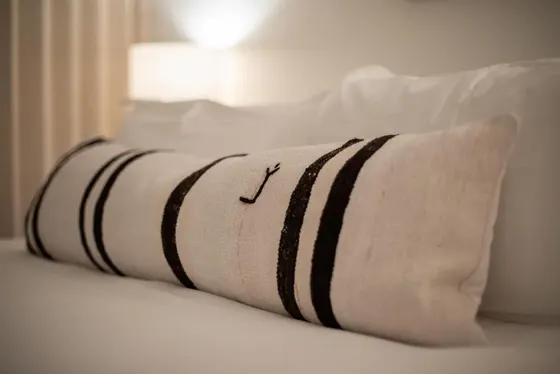 Pillow sitting on top of a bed