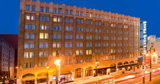 Large brick building on a city street at night