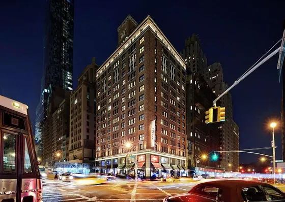 Large building on a city street at night