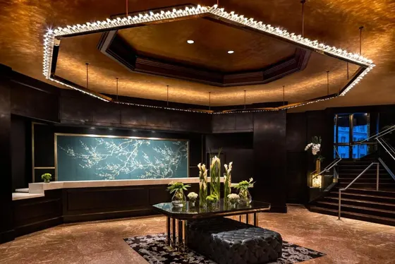 Lobby with a table and a chandelier