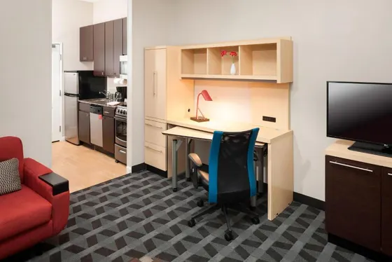Small office with a desk and a red chair