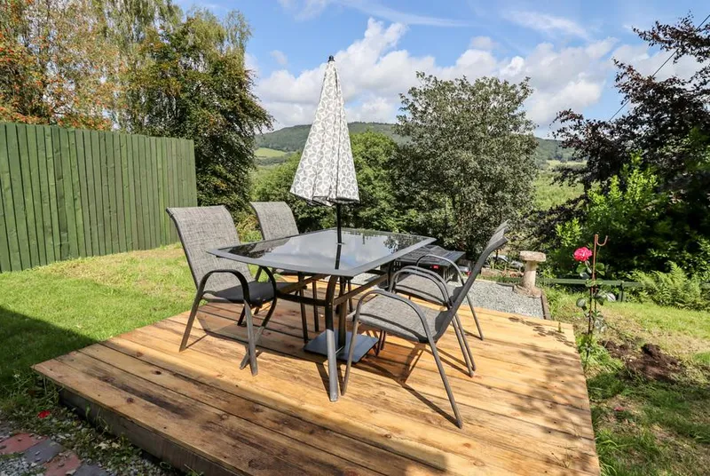 Trem Y Don deck dining area in the garden