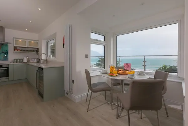Tresco Bungalow breakfast nook with wide sea view
