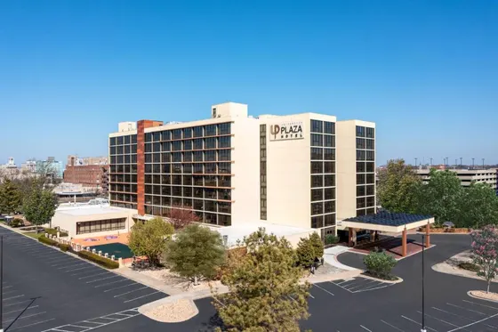 Large white building with a sign on it