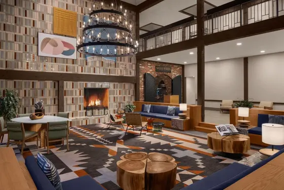 Lobby with a fireplace and tables and chairs