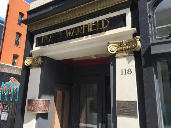 Building with a sign that reads lost wanted