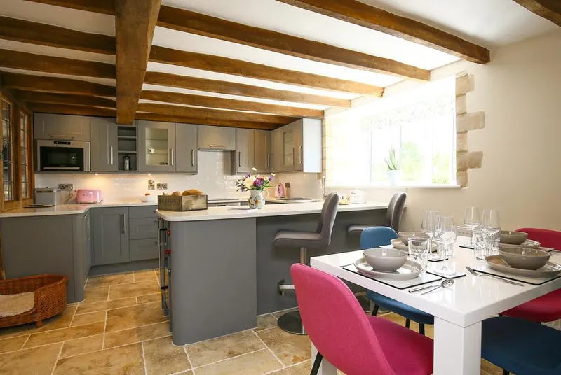 Washpool open-plan kitchen diner with beams and island seating