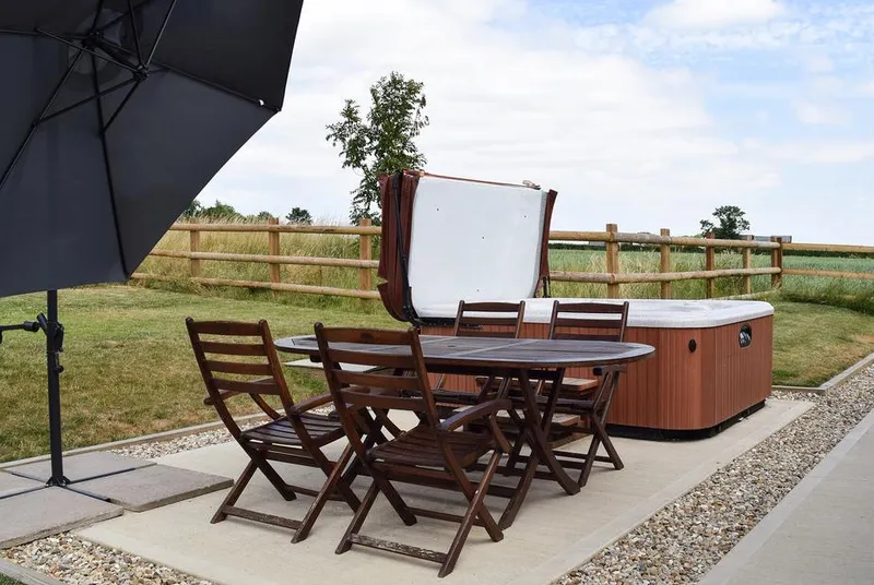 Waxwing Cottage hot tub terrace with open farm views