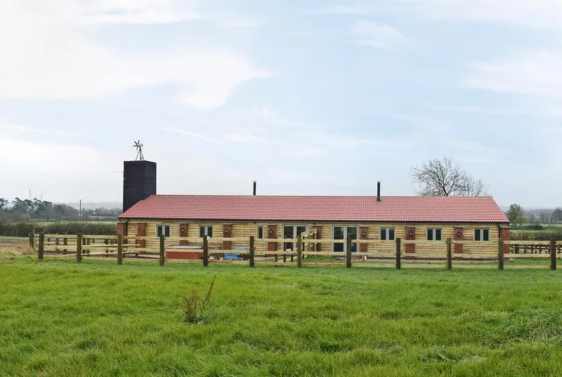 Waxwing Cottage lodge exterior in its rural farm setting
