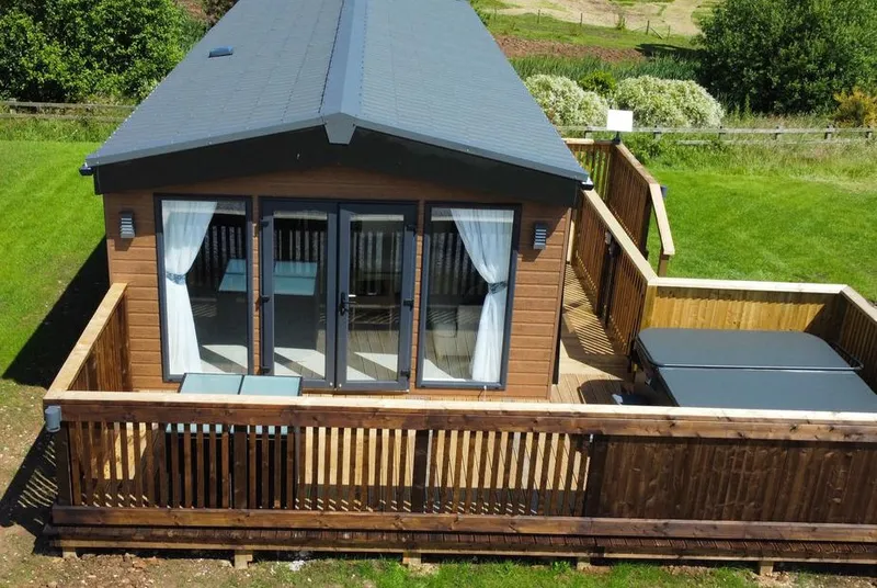 Willow Lodge aerial view showing deck and hot tub in Yorkshire countryside
