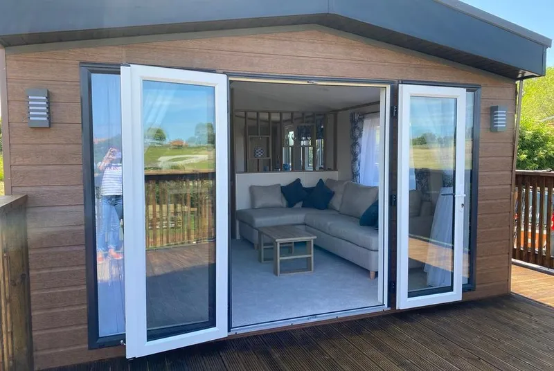 Willow Lodge facade with bi-fold doors open to living room