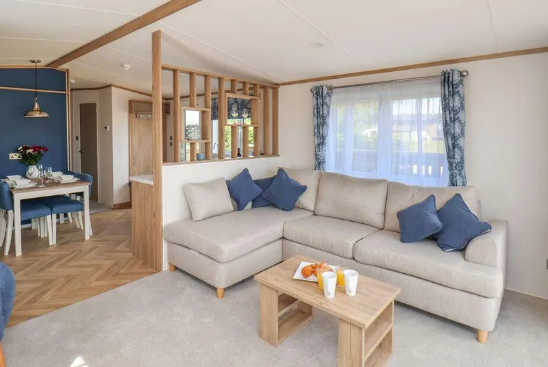 Willow Lodge open-plan living area with oak room divider and herringbone flooring