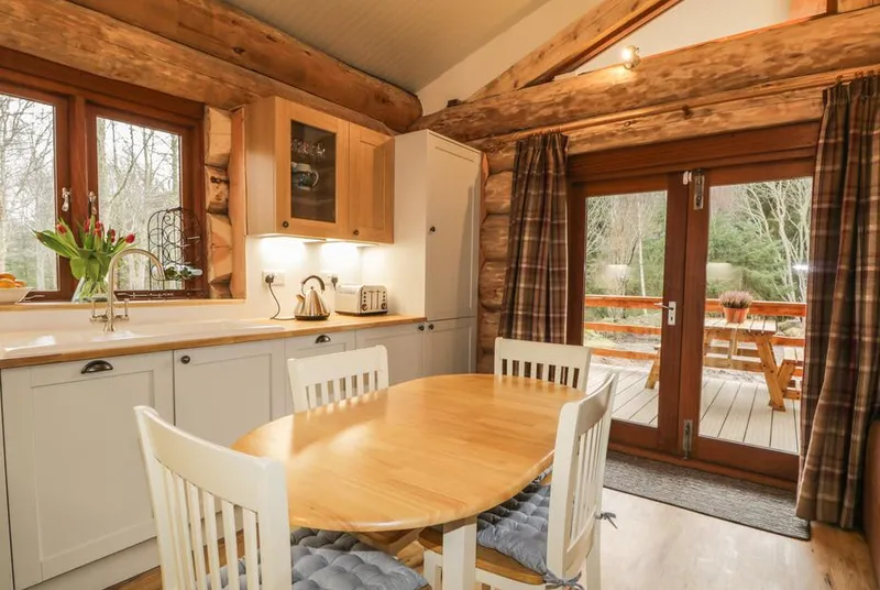 Moorhen Lodge kitchen dining area with veranda doors