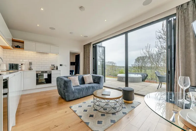 Woodland View Retreat living room with oak floors and bi-fold doors