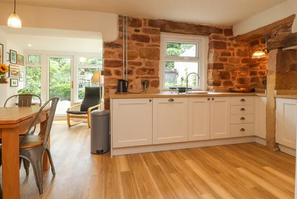 Woodman Cottage kitchen and dining area with garden doors