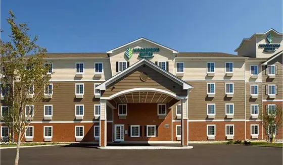 Large apartment building with an archway in front of it